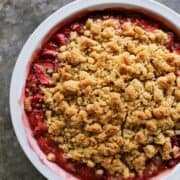 strawberry rhubarb crumble in a white pie plate