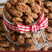 Pinterest image of candied pecans in a jar