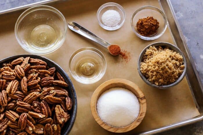 pecans, egg white, sugar, brown sugar, salt, cinnamon, cayenne pepper, vanilla extract