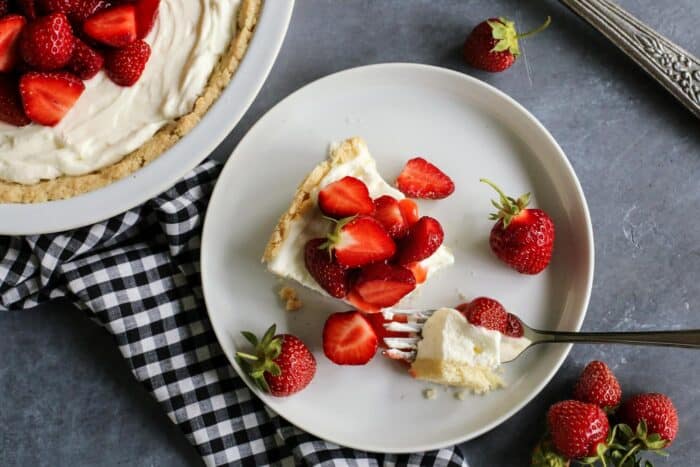 strawberry cream cheese pie with a forkful taken out of it