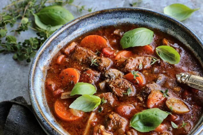 close-up view of stew in a blue bowl