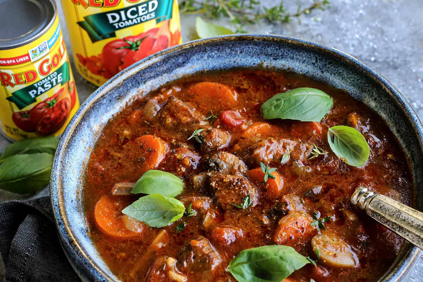 beef stew and cans of Red Gold diced tomatoes and tomato paste