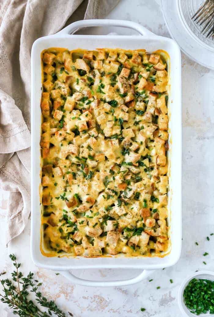 rectangular white dish of baked turkey stuffing casserole