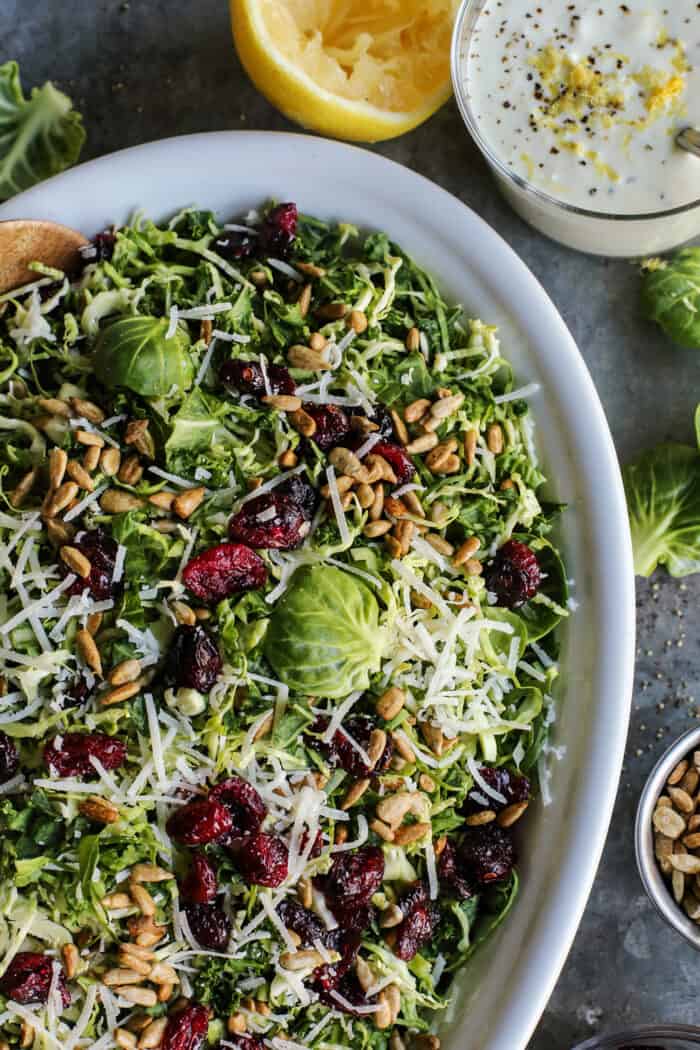 salad with Brussels sprouts, kale, dried cranberries, sunflower nuts, Parmesan, and lemon yogurt dressing