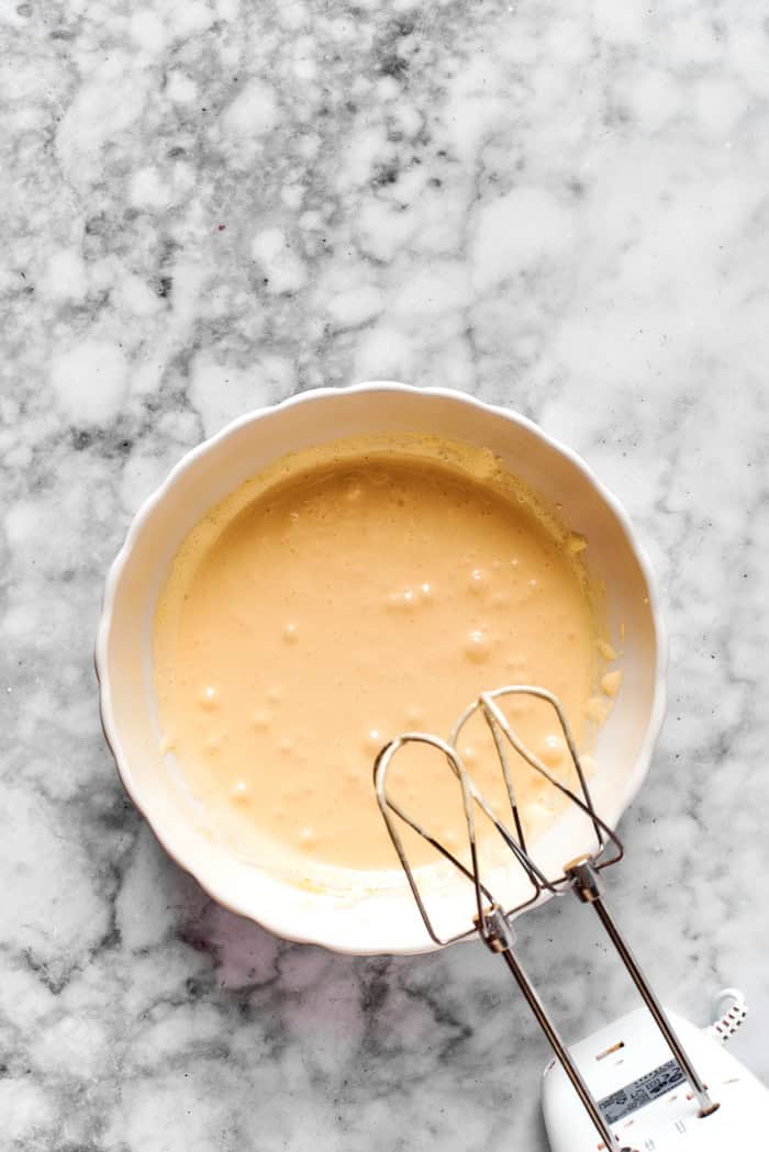 Pale egg mixture in a mixing bowl.