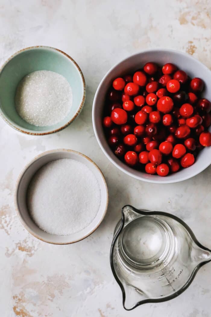 fresh cranberries, granulated sugar, sanding sugar, and water