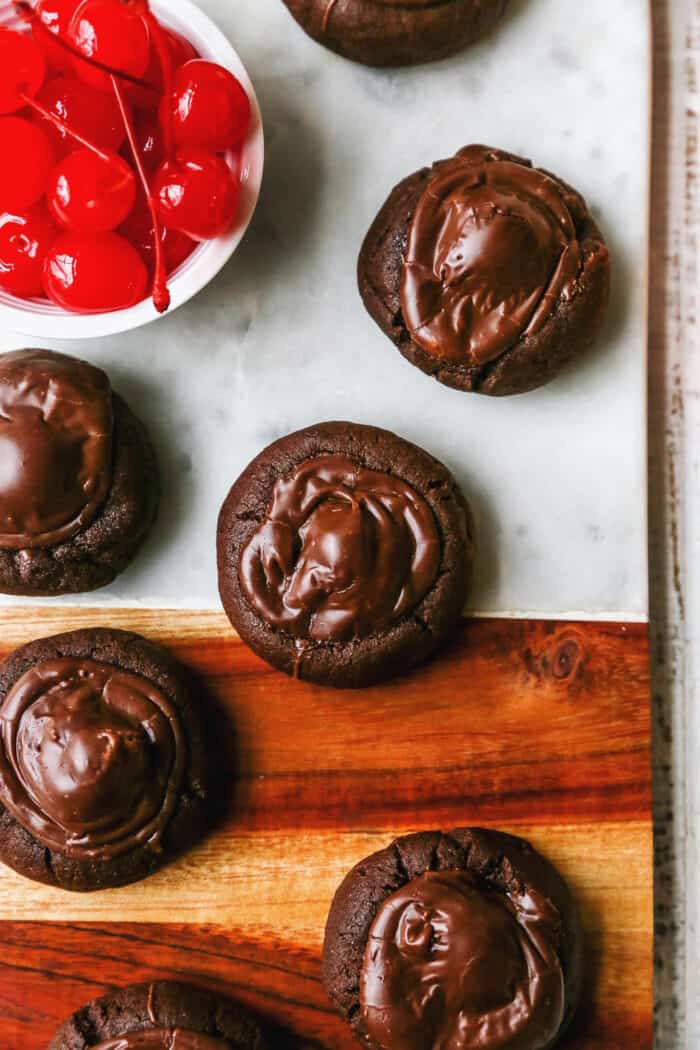 chocolate cookies with maraschino cherries and chocolate frosting