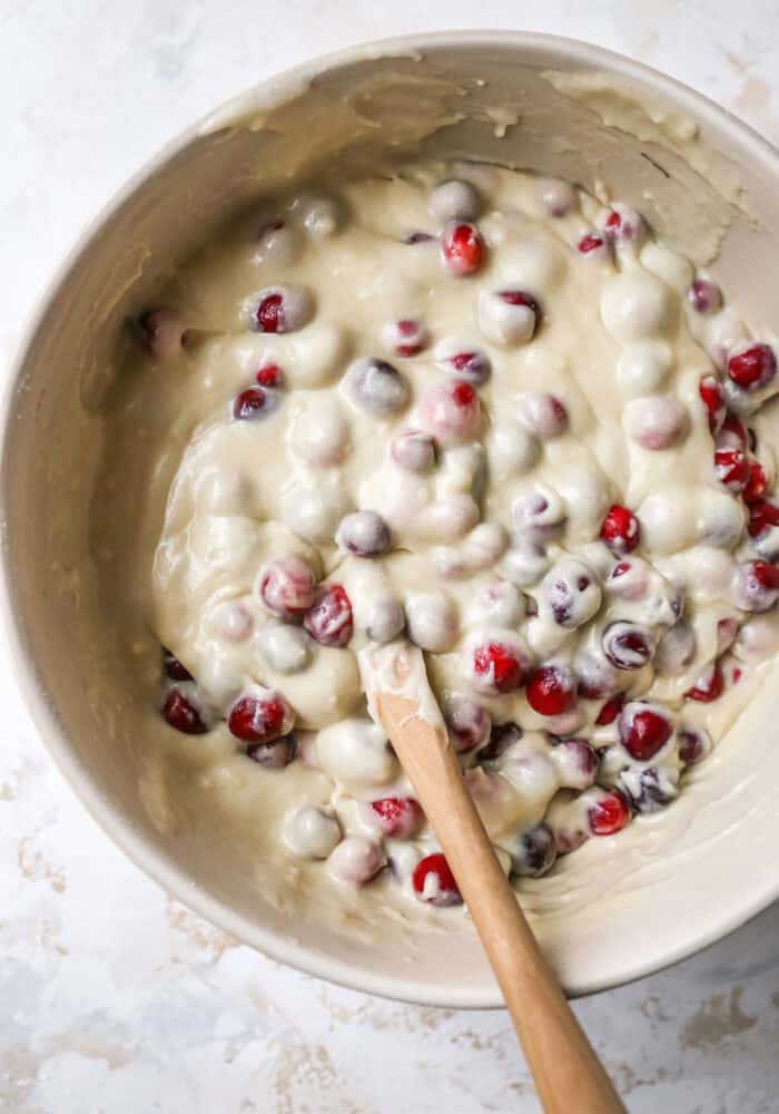 a mixing bowl of cranberry cake batter