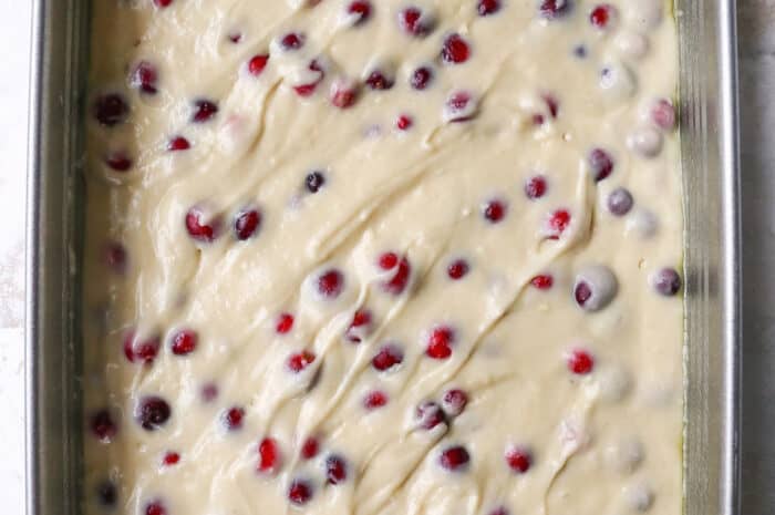 cranberry cake batter in a pan
