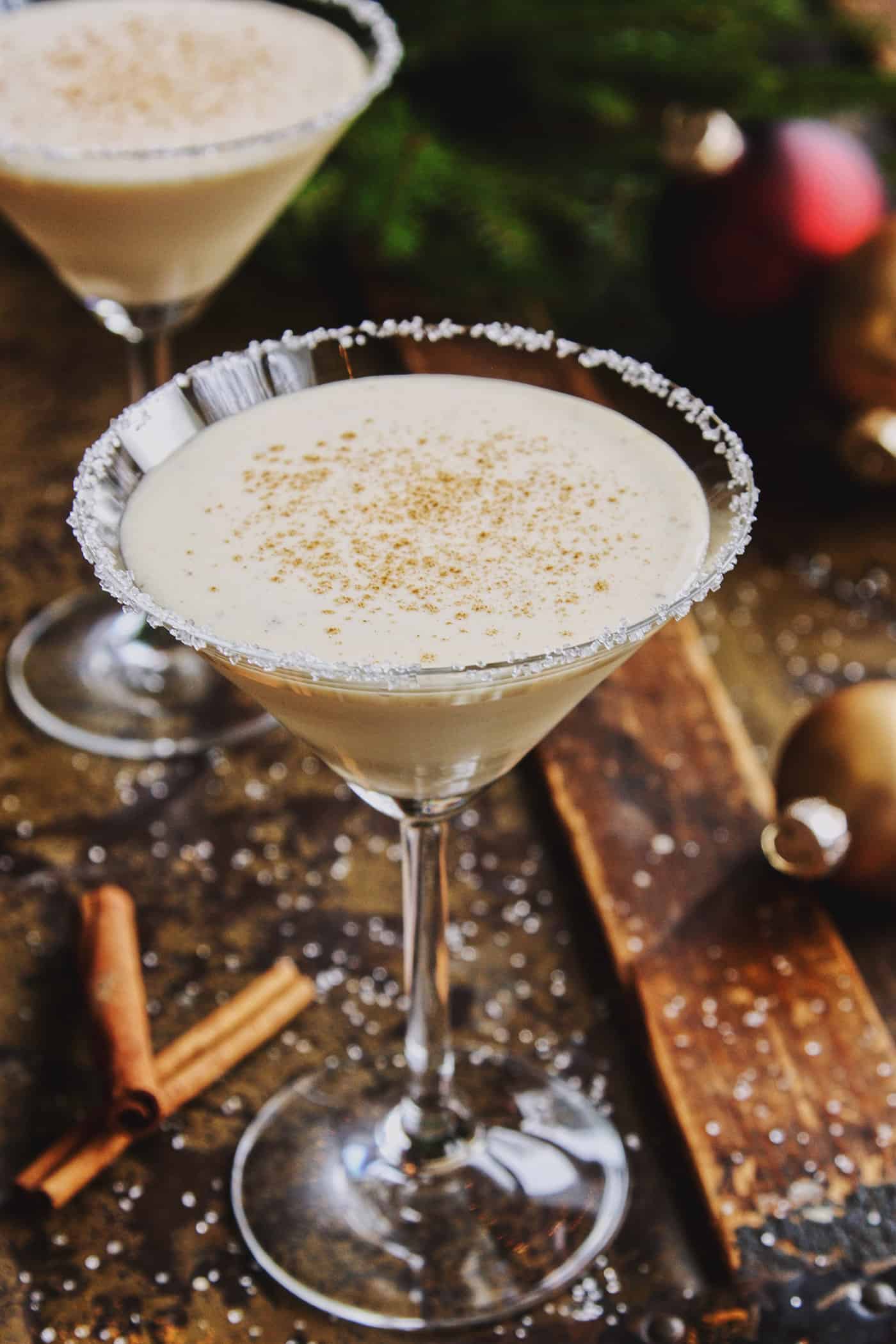 two glasses of eggnog cocktail in martini glasses