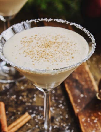 an eggnog drink in a martini glass