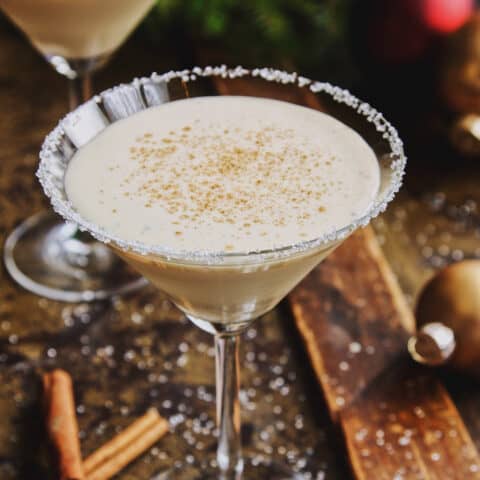 an eggnog drink in a martini glass