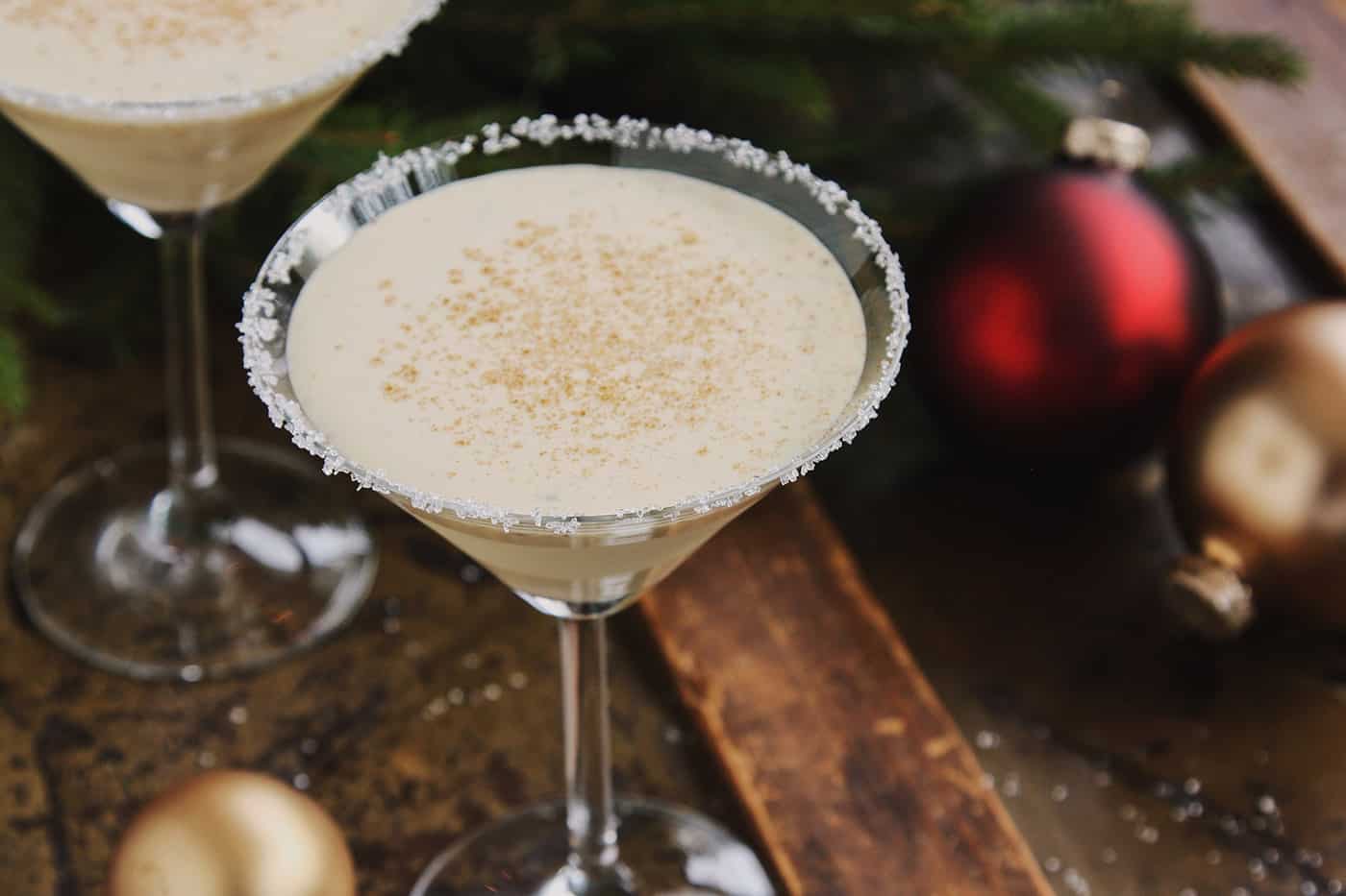 a martini glass of eggnog cocktail