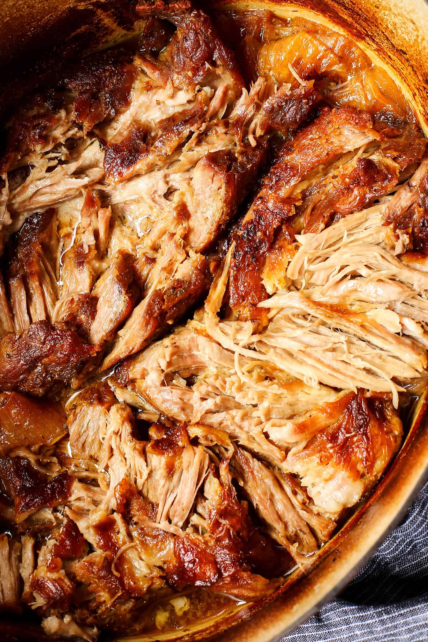 pork carnitas meat, shredded in a big pot