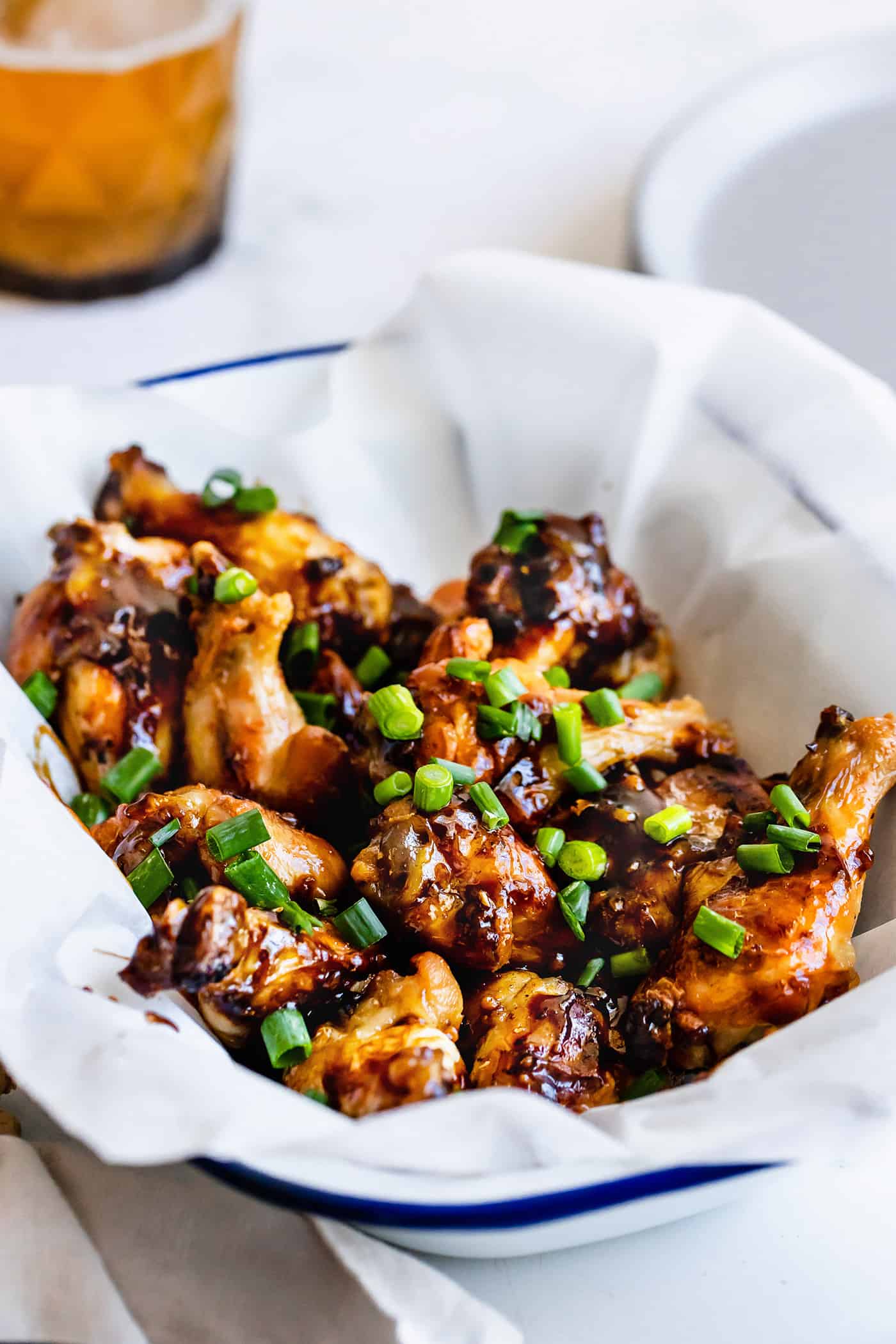 These Crispy Baked Chicken Wings are super juicy with crackly golden skins. Delicious plain, or toss them with sweet-savory oyster sauce! a tray of crispy baked chicken wings with oyster sauce