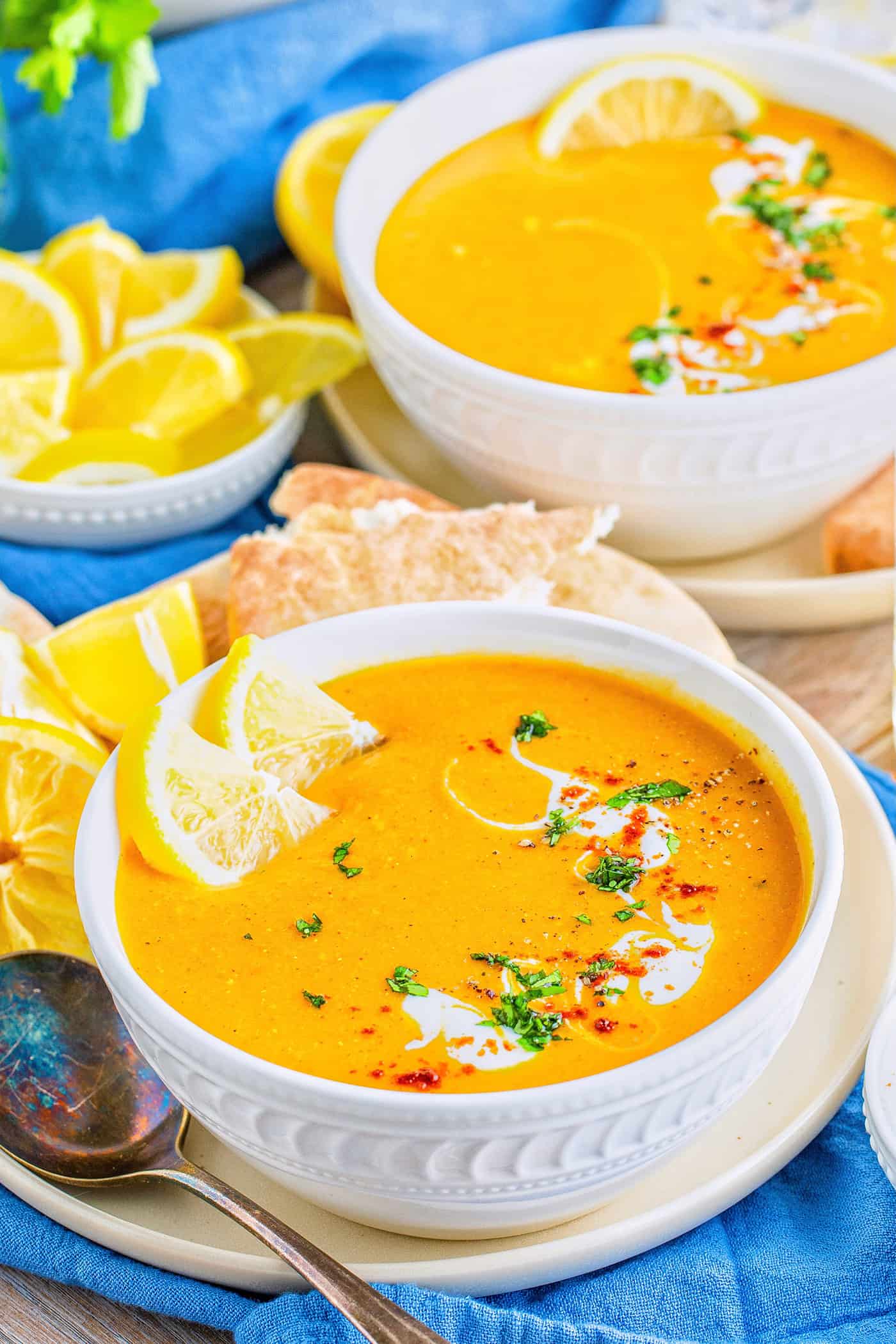 red lentil soup in white bowls