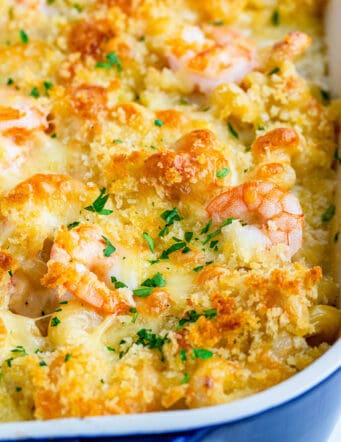 macaroni and cheese with shrimp, baked in a blue casserole dish