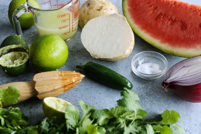 ingredients for watermelon salsa: fresh watermelon, jicama, onion, jalapeno, lime, cilantro