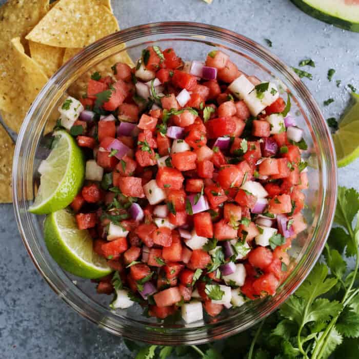watermelon salsa in a clear bowl with tortilla chips