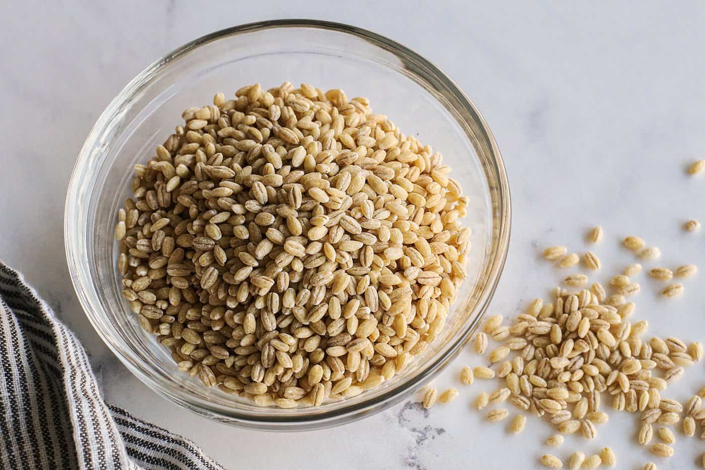 a small clear bowl of uncooked pearled barley