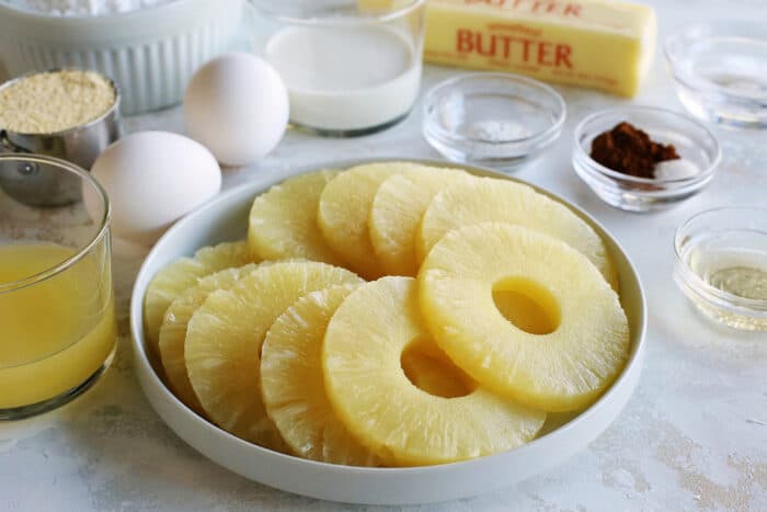 close-up of pineapple rings, plus other ingredients to make pineapple cake