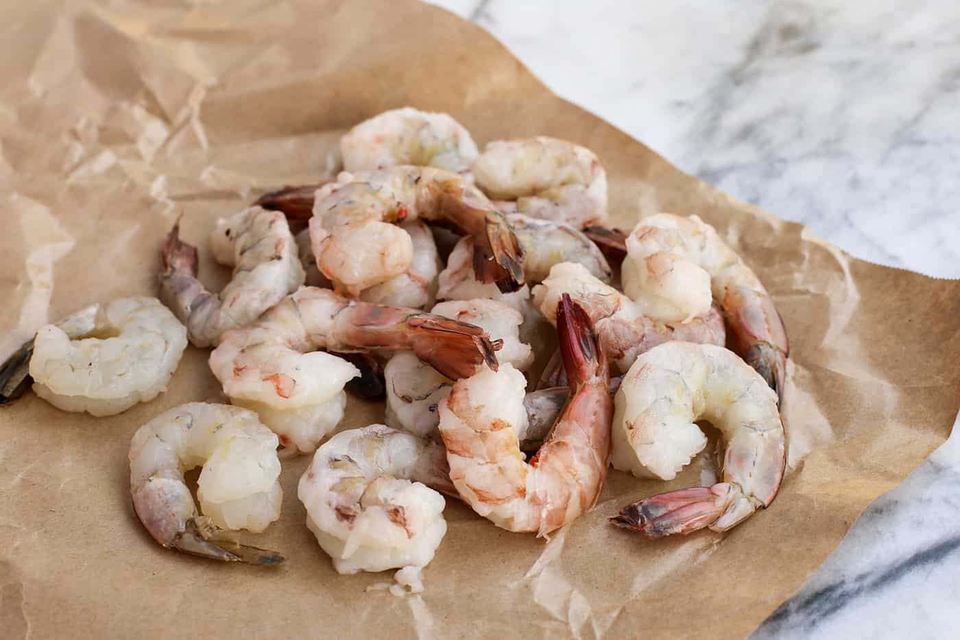 Raw shrimp on a brown paper wrapper