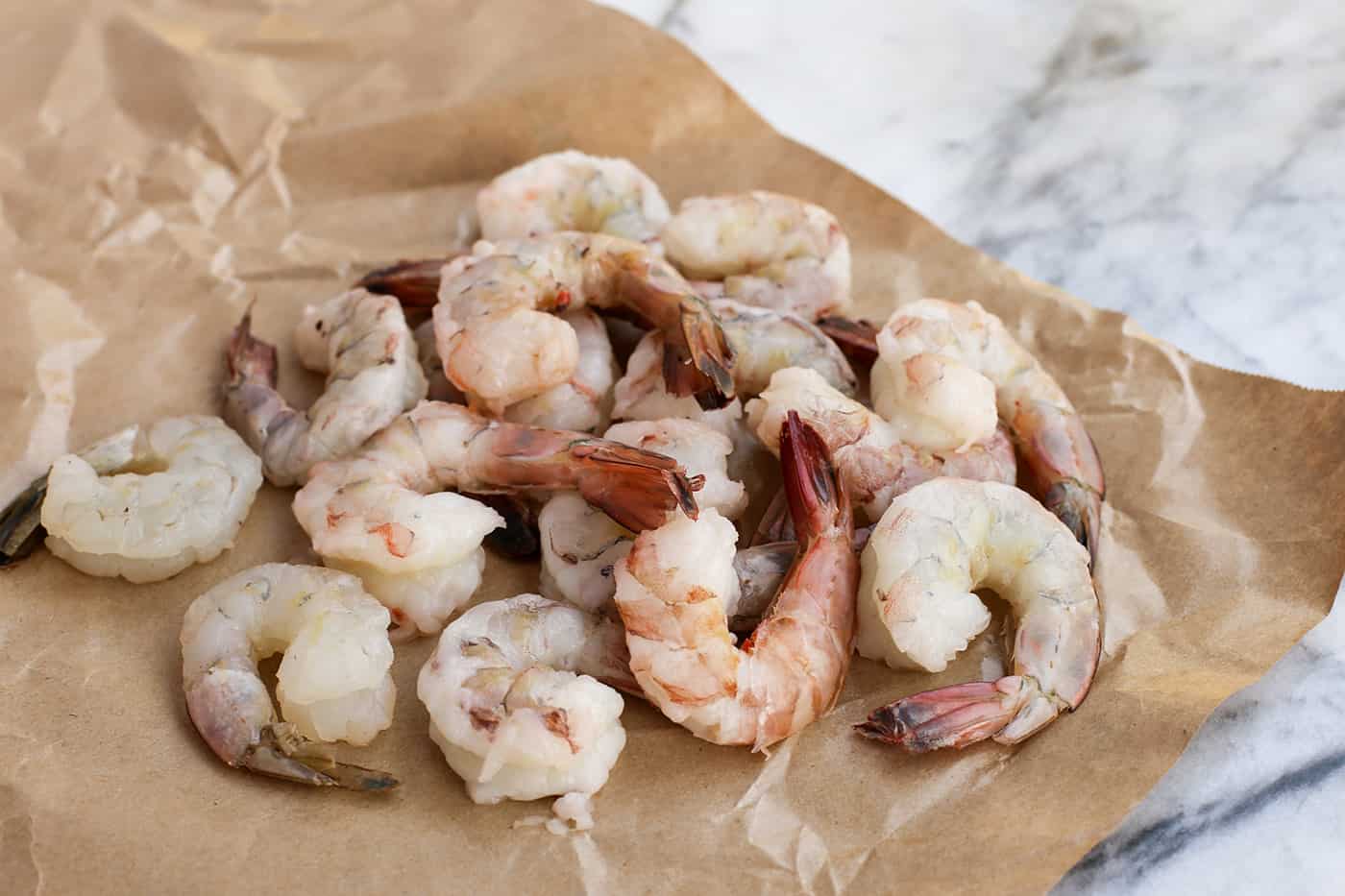 Raw shrimp on a brown paper wrapper