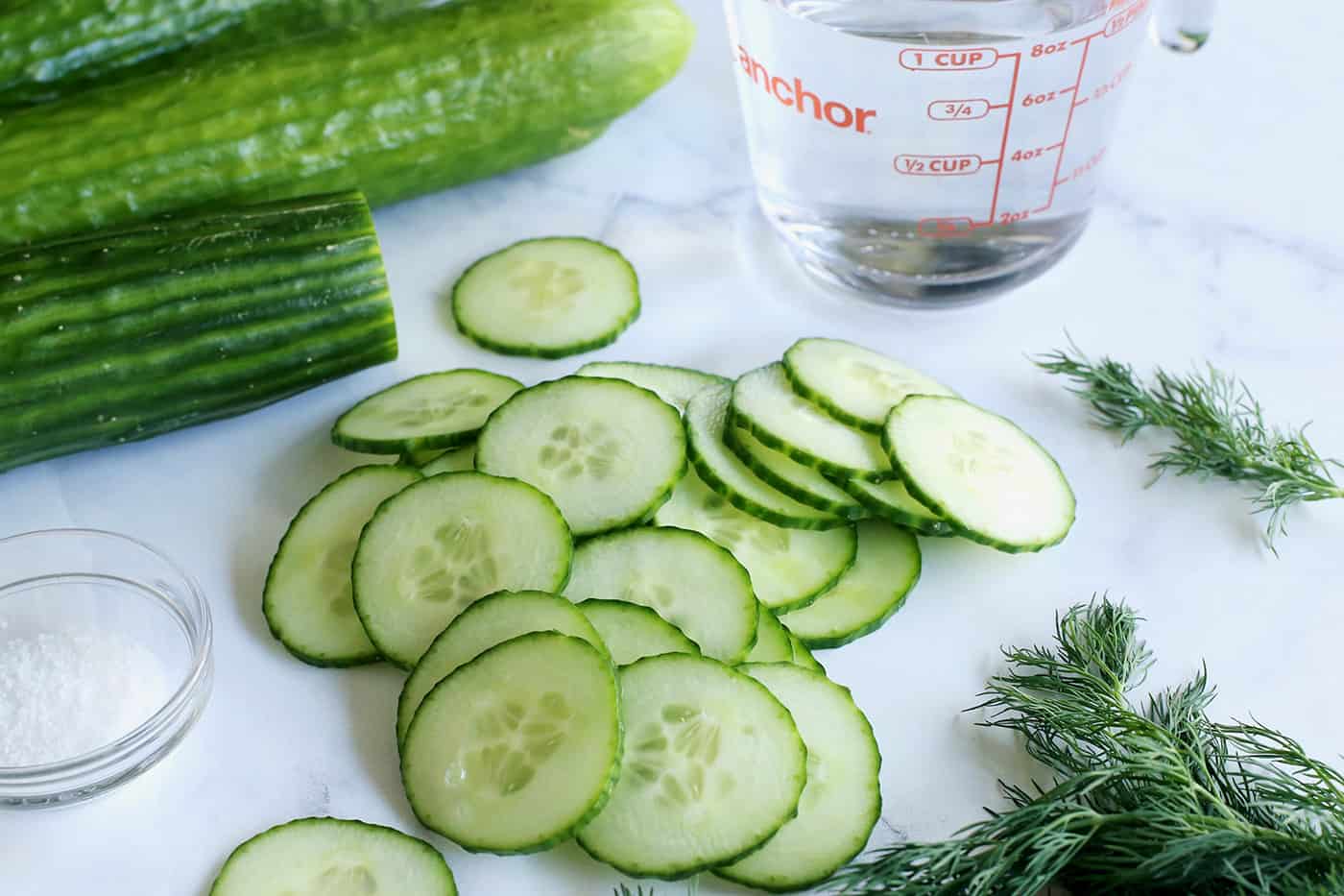 cucumbers, sliced cucumbers, fresh dill, salt, and white vinegar