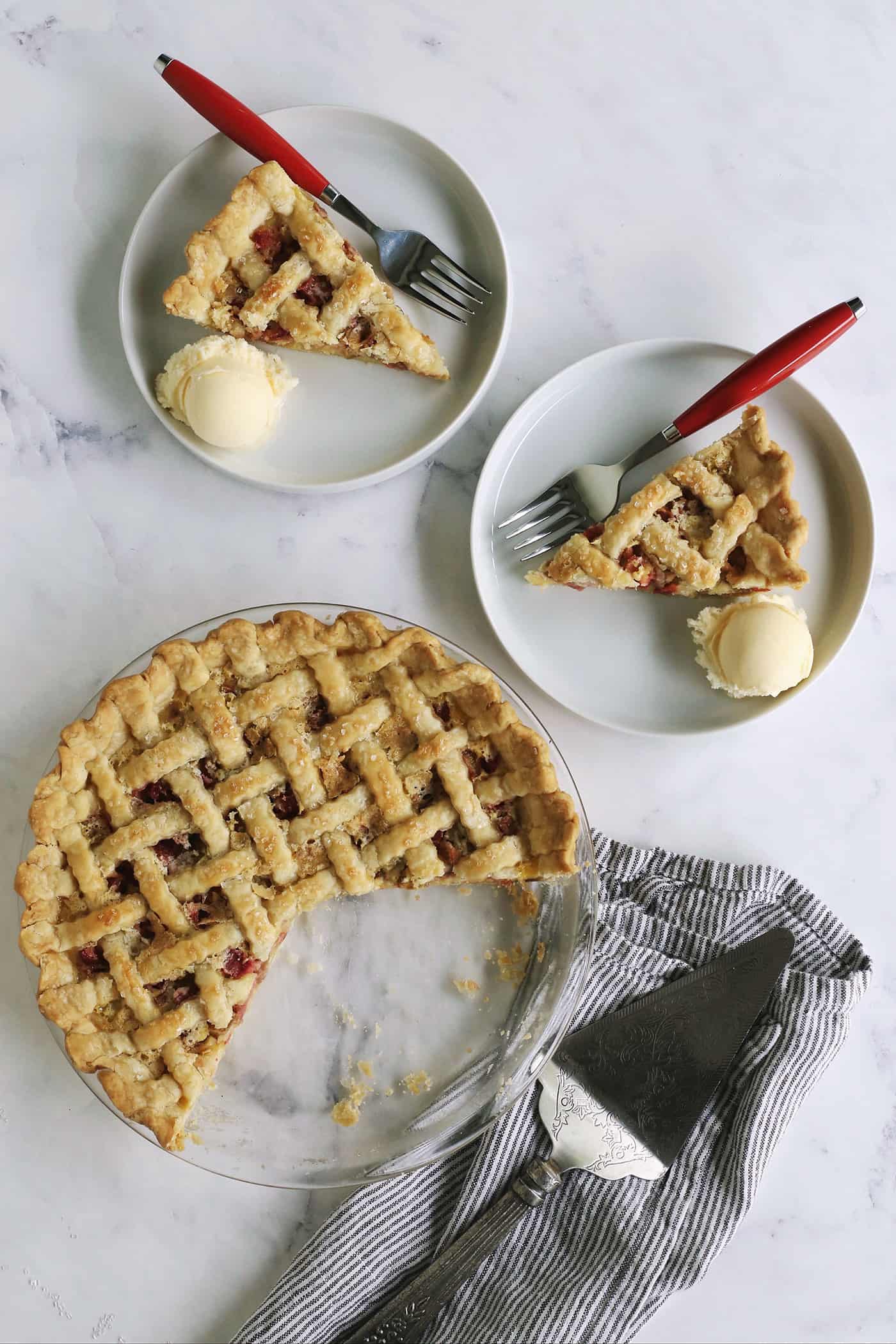 overhead photo of rhubarb pie, with two pieces on individual plates