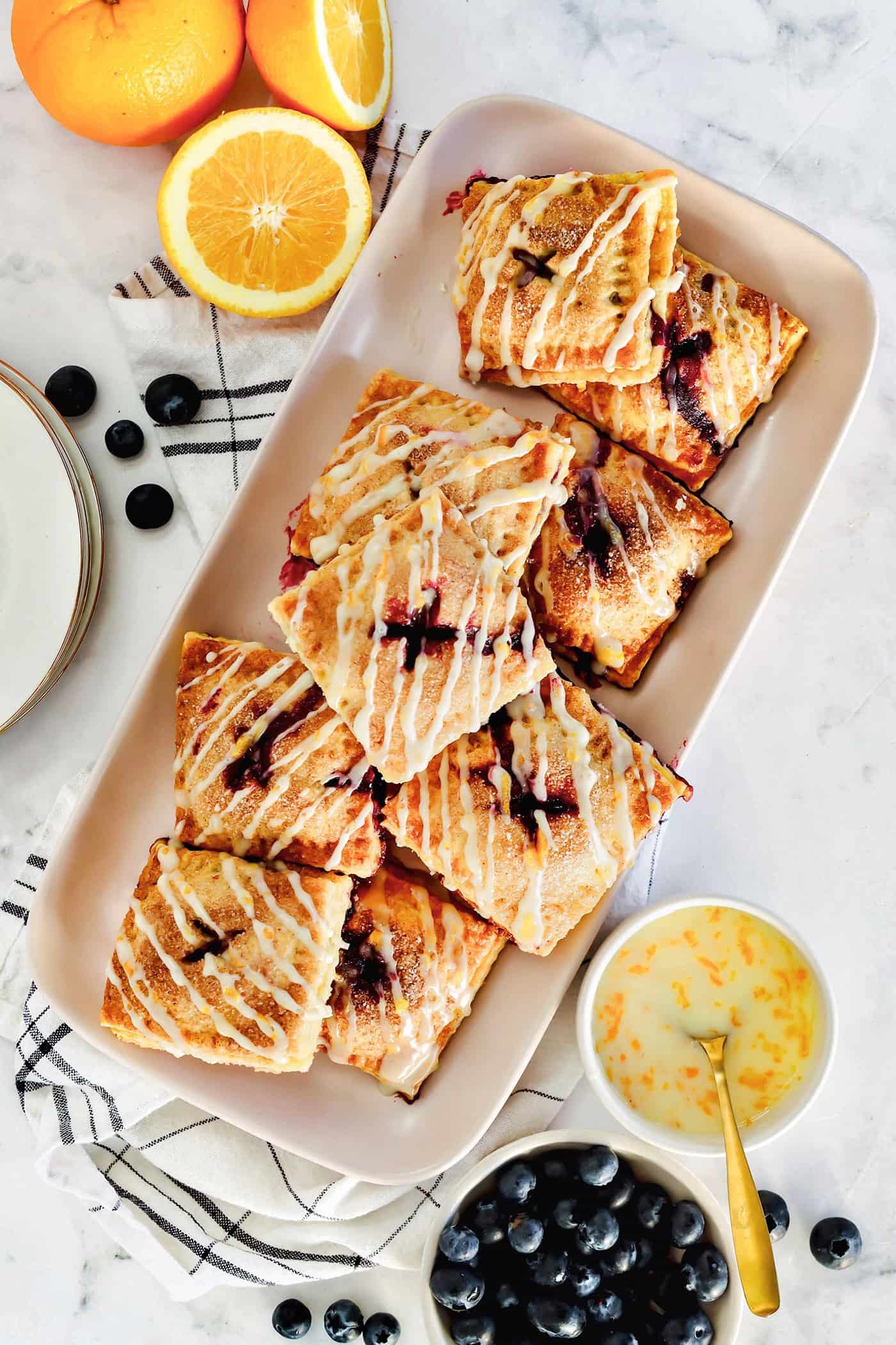 hand pies with fresh blueberry filling, on a rectangular platter