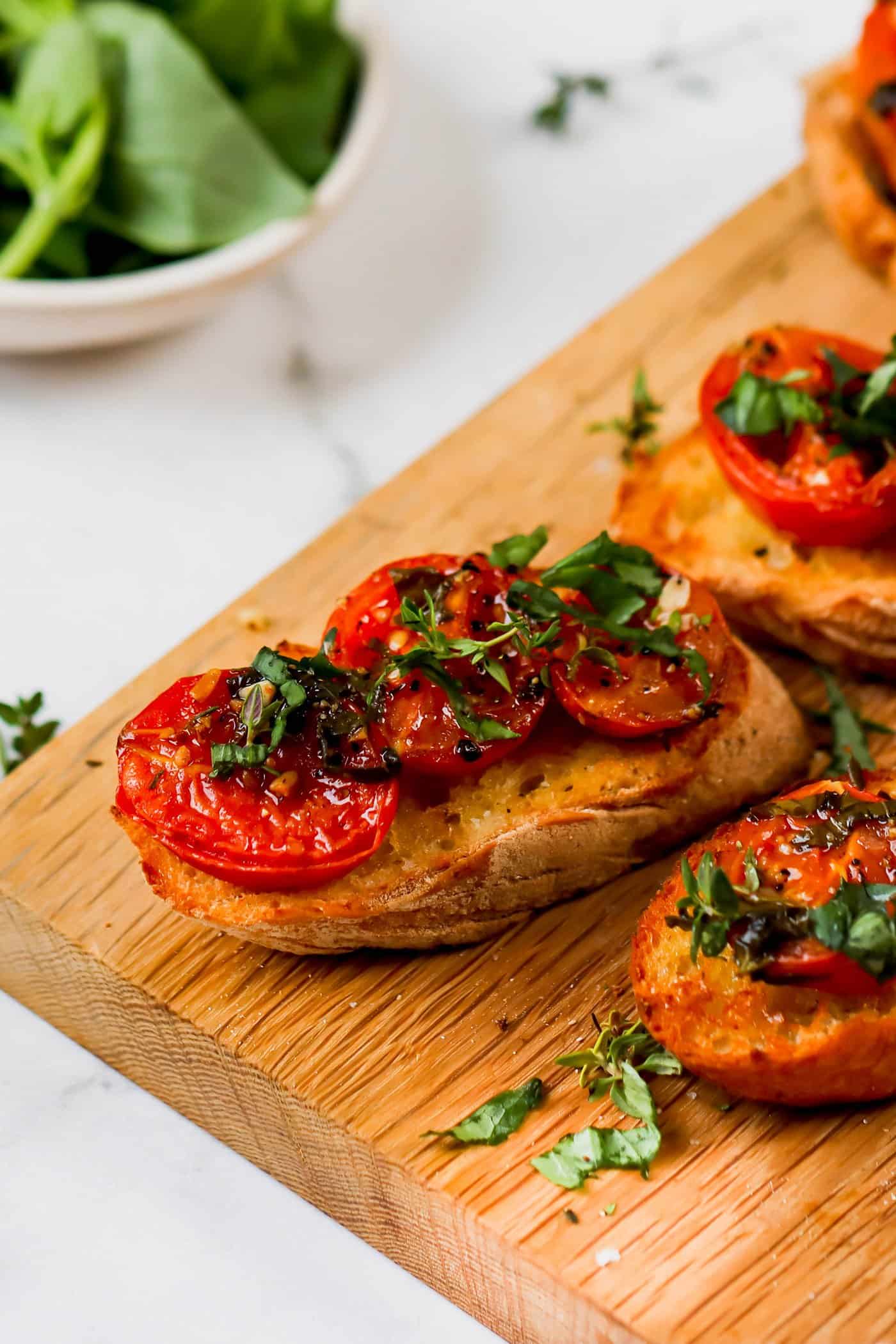 oven roasted tomatoes on toasted baguette slices