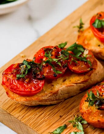 oven roasted tomato halves on slices of toasted baguette