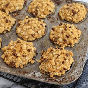 Pumpkin streusel muffins in a muffin tin.