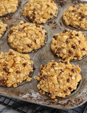 Pumpkin streusel muffins in a muffin tin.