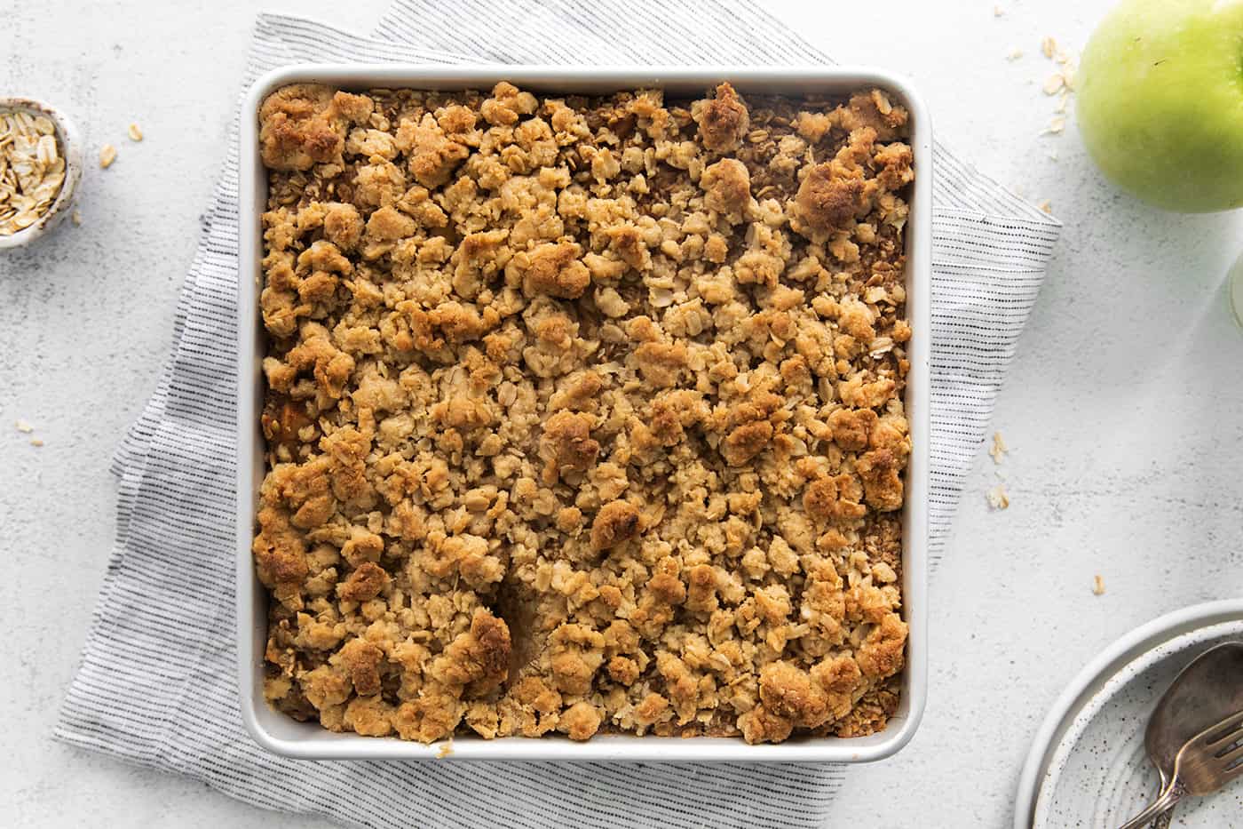 overnight baked apple oatmeal in a square white baking dish