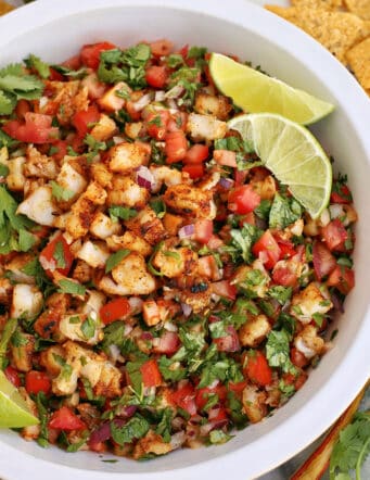 grilled shrimp ceviche in a white bowl, with tortilla chips