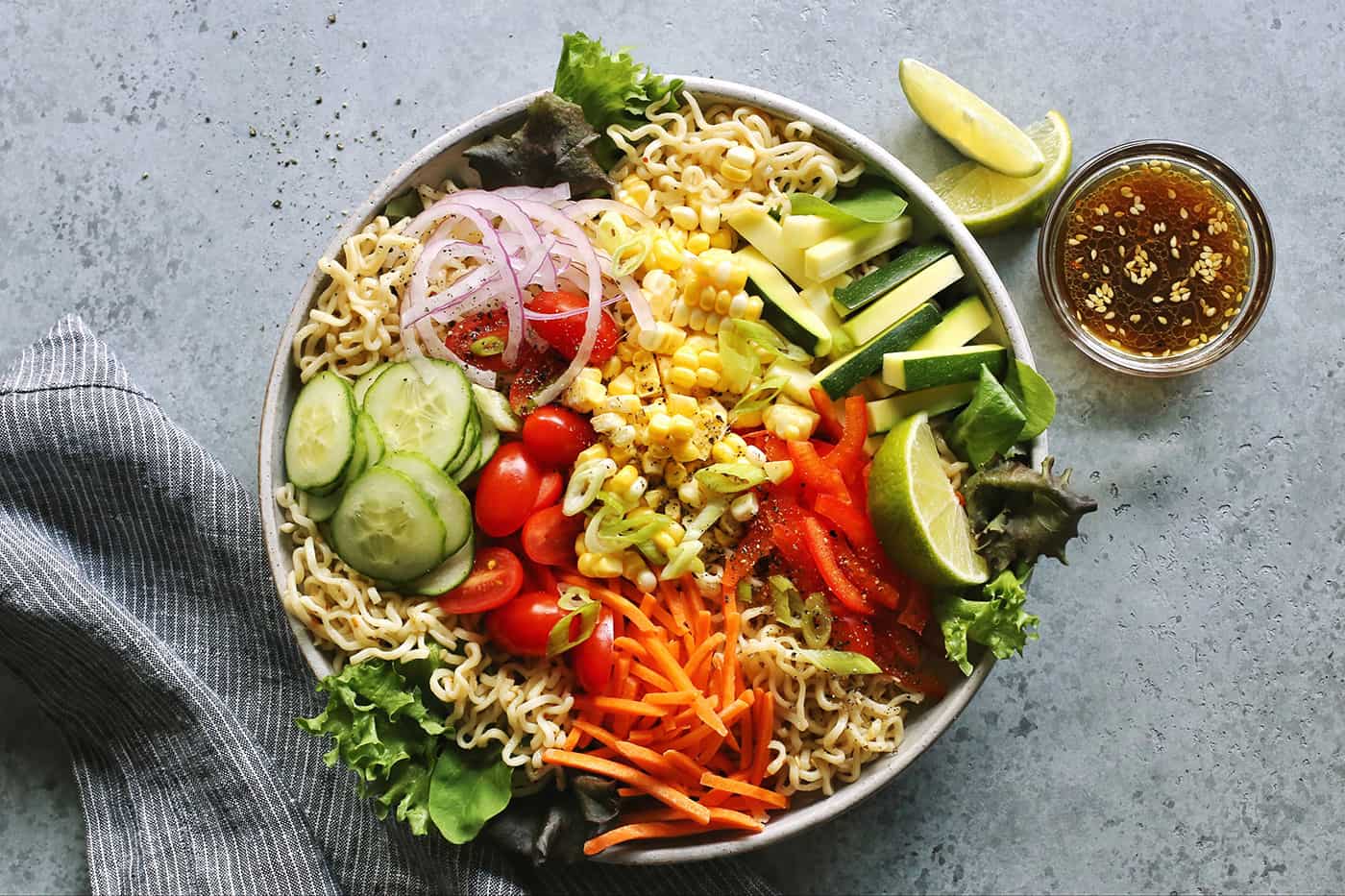 a light gray bowl of salad ramen