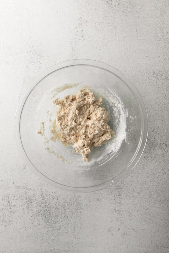 dough in a clear mixing bowl