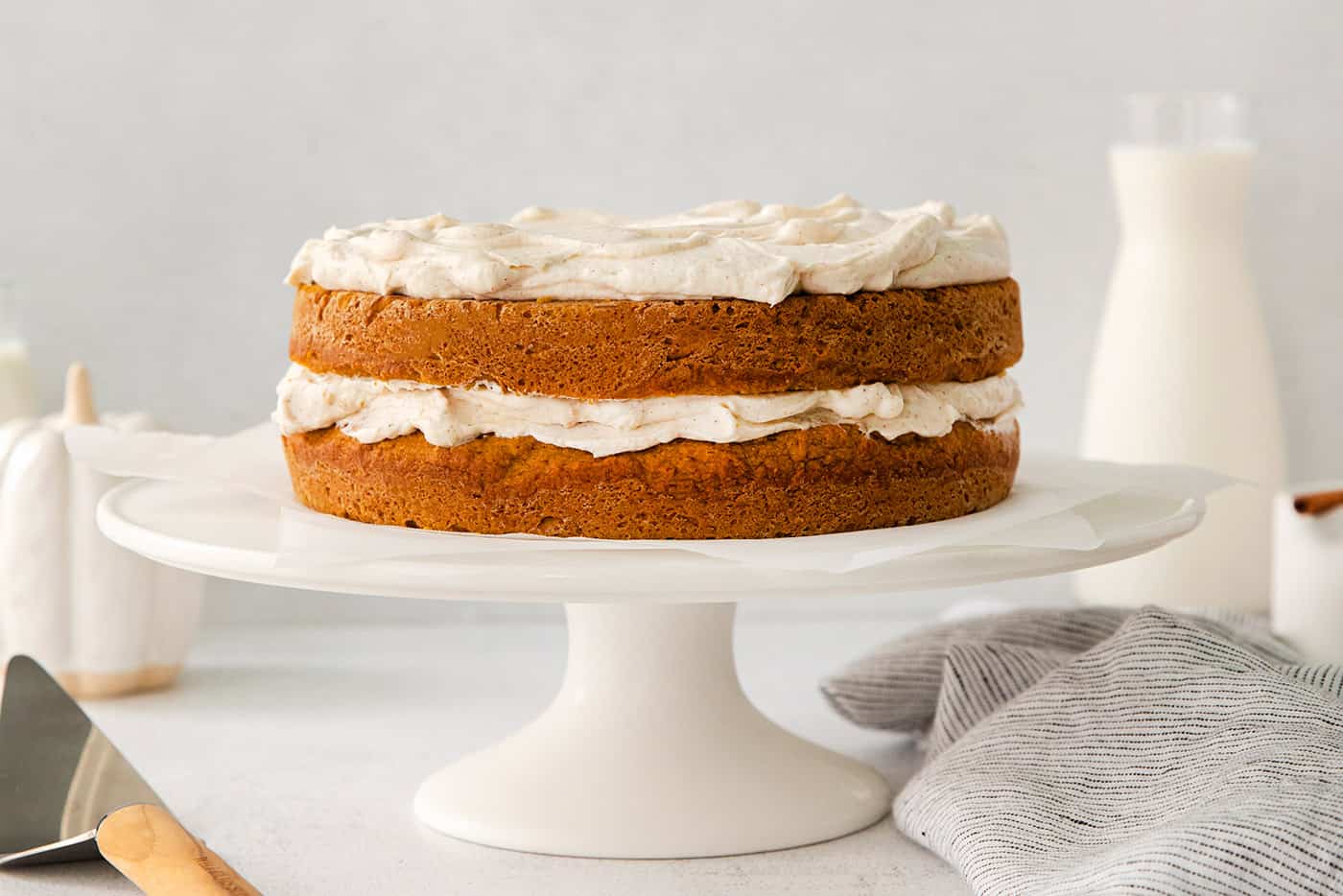 double layer pumpkin cake with creamy cinnamon whipped topping