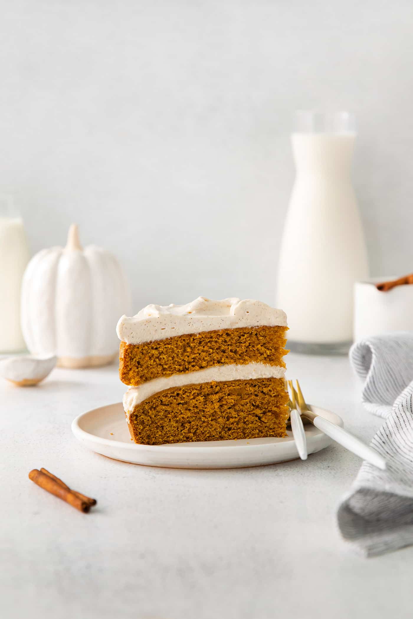 a piece of double layer pumpkin cake on a plate