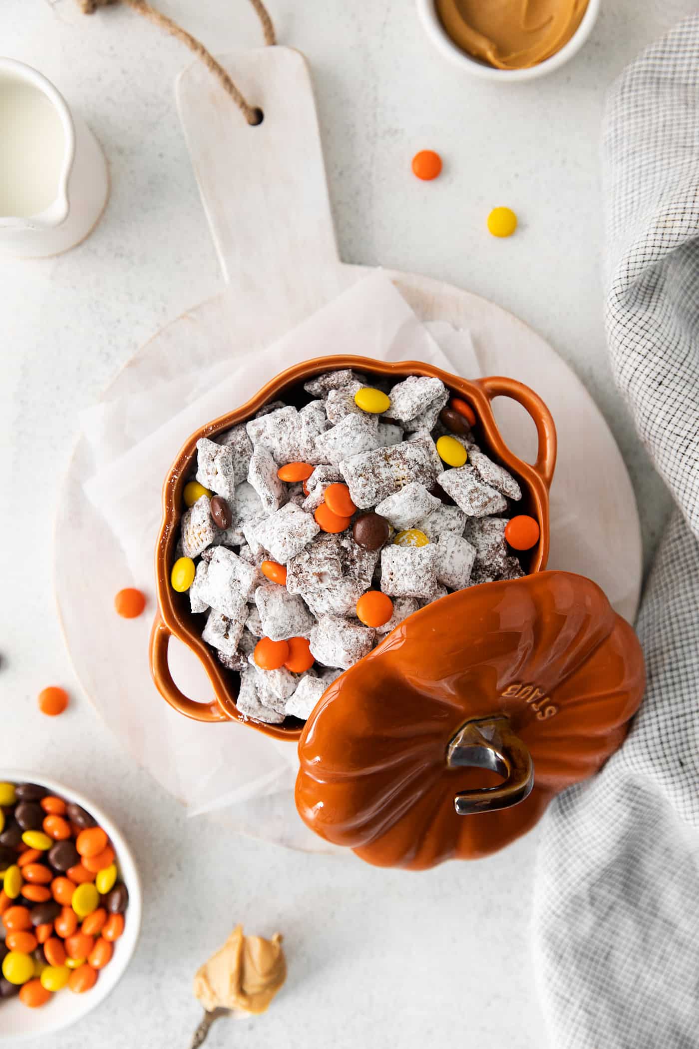 a pumpkin bowl full of Halloween Muddy Buddies