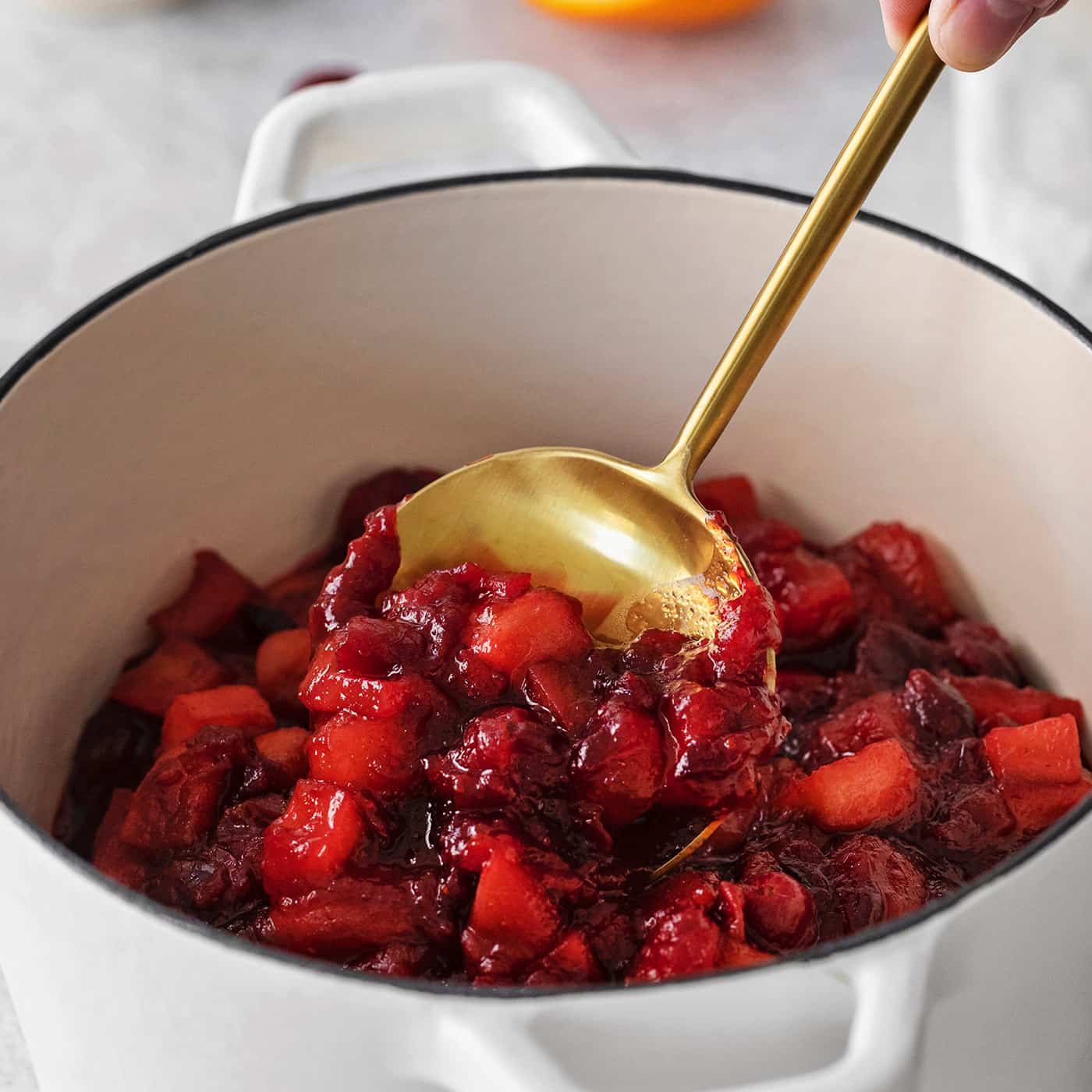 homemade cranberry sauce in in a white pot