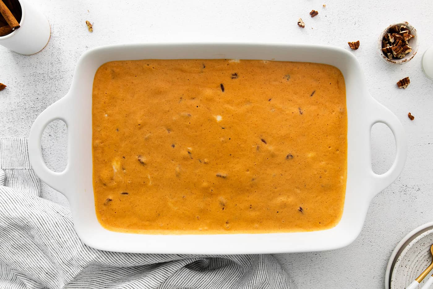 frozen pumpkin dessert in a white pan