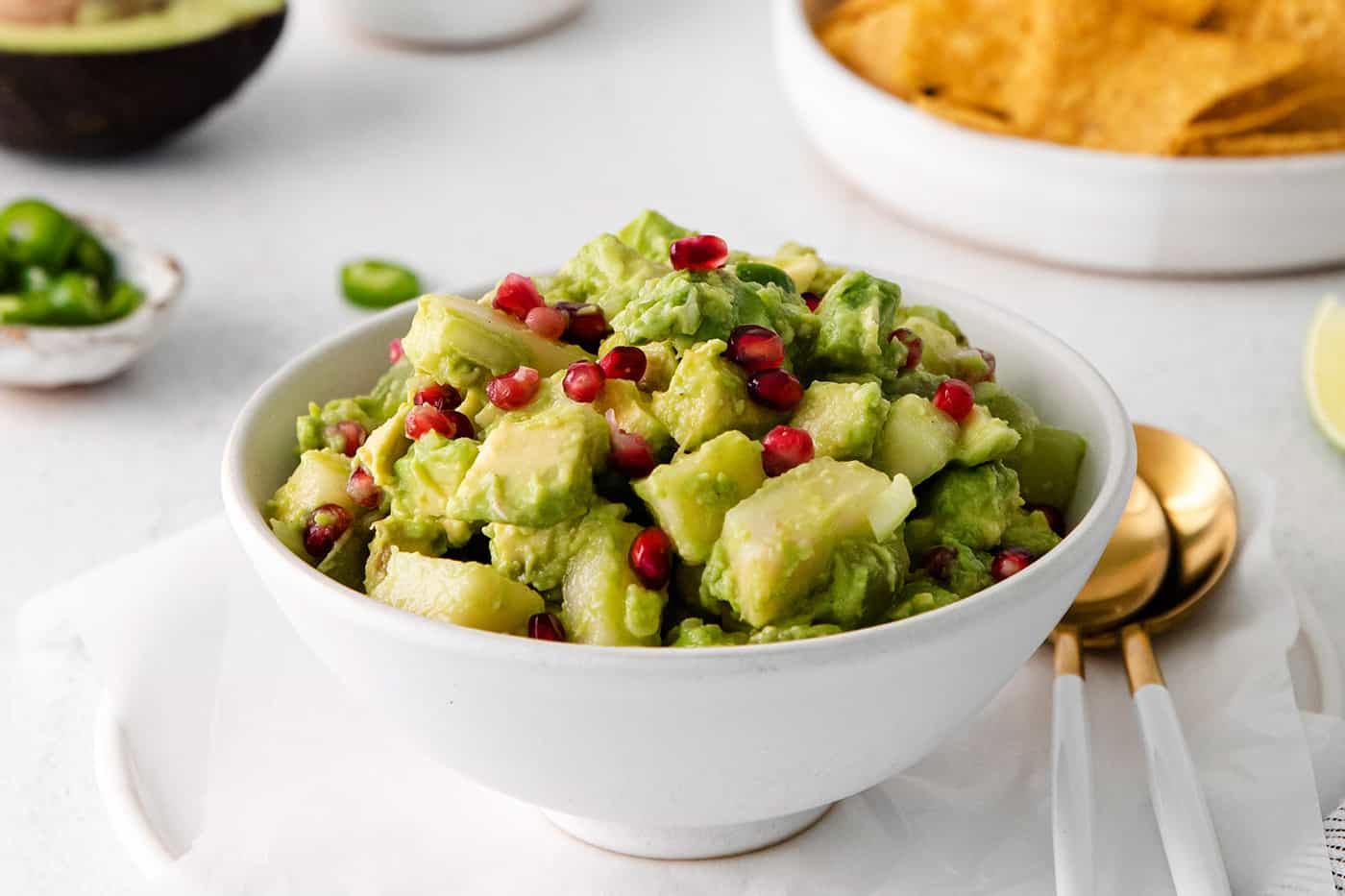 A white bowl of holiday guacamole