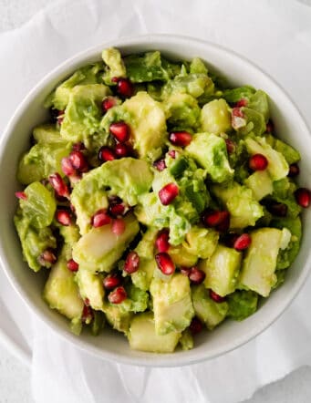 Overhead view of holiday guacamole in a bowl.