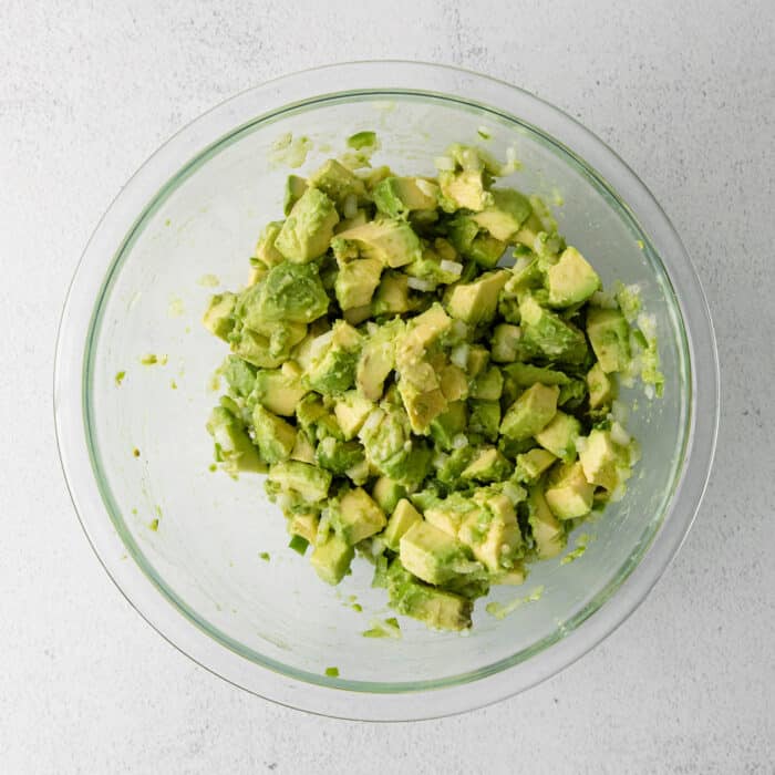 Chopped avocado in a glass bowl