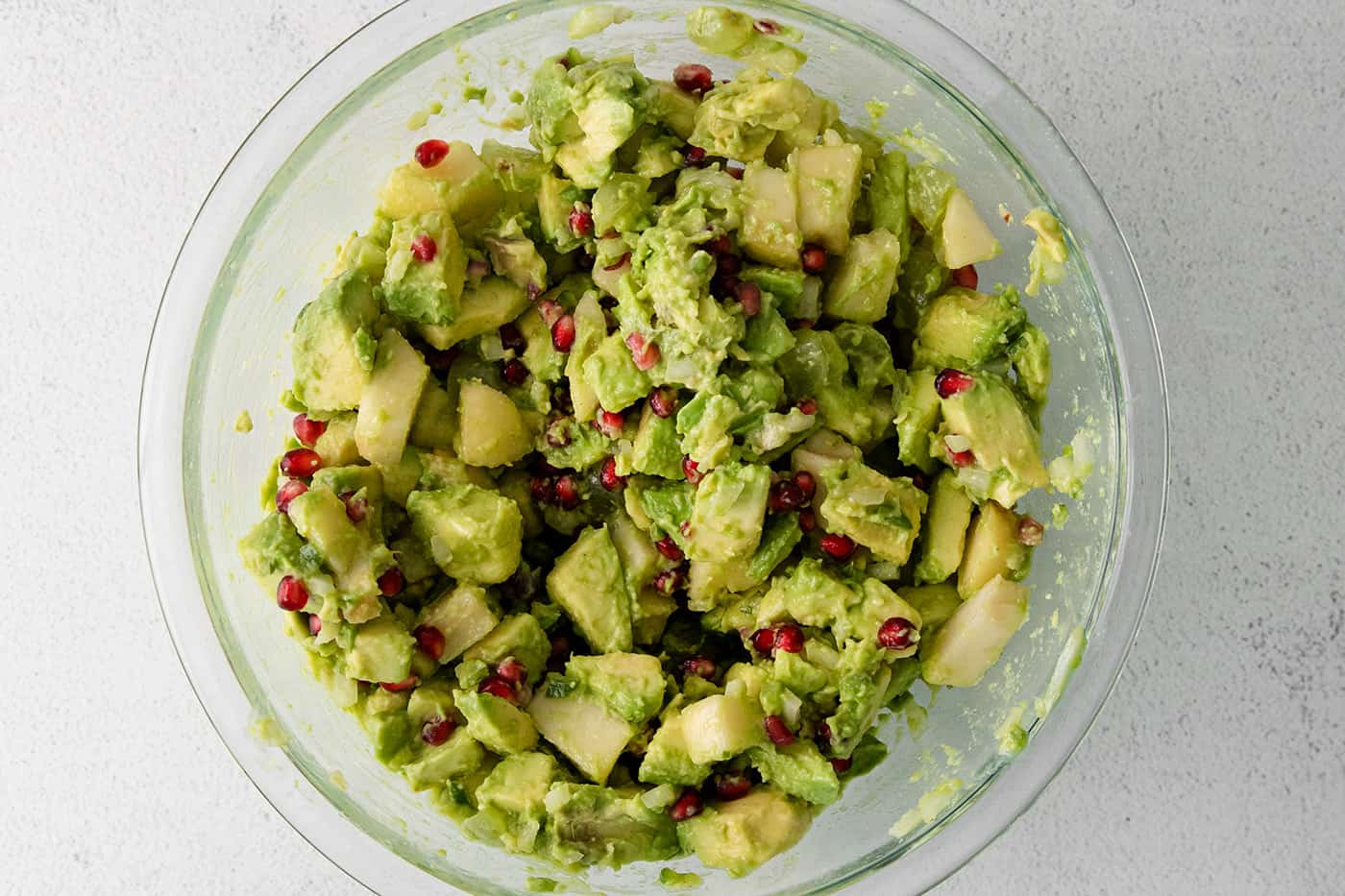 Holiday guacamole mixed in a bowl