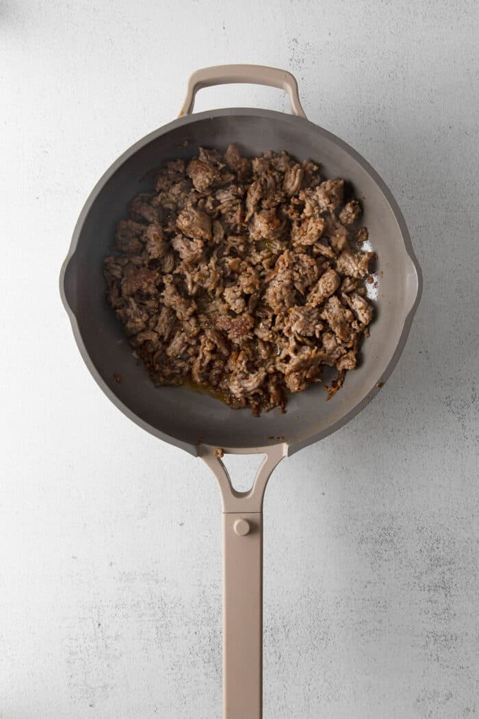 Cooked Italian sausage in a skillet