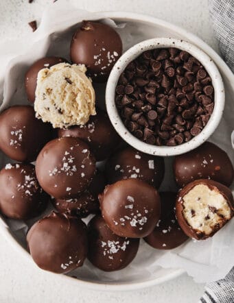Overhead view of cookie dough truffles on a white plate