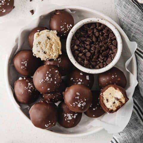 Overhead view of cookie dough truffles on a white plate